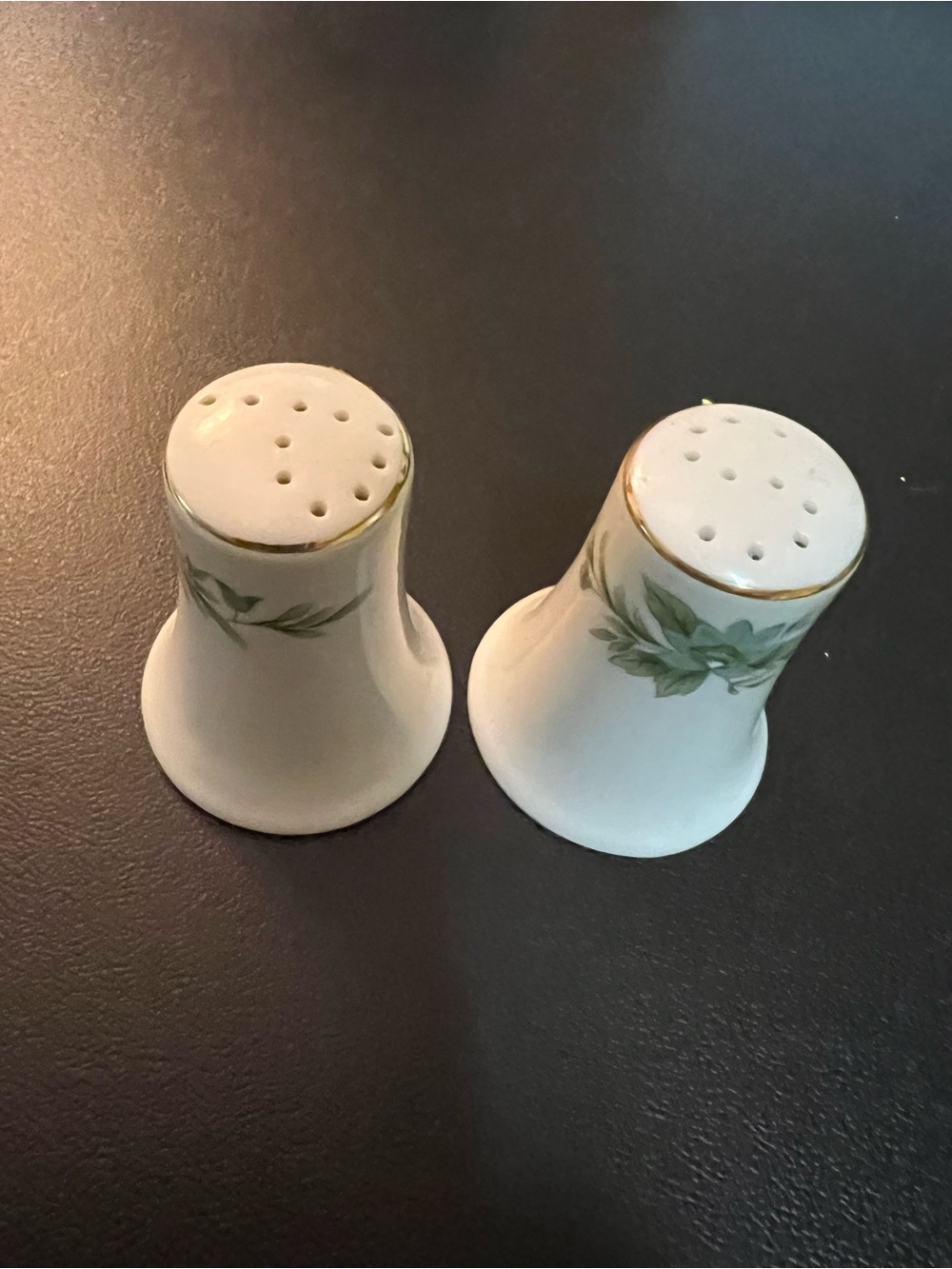 White and green floral porcelain salt and pepper shakers with gold trim